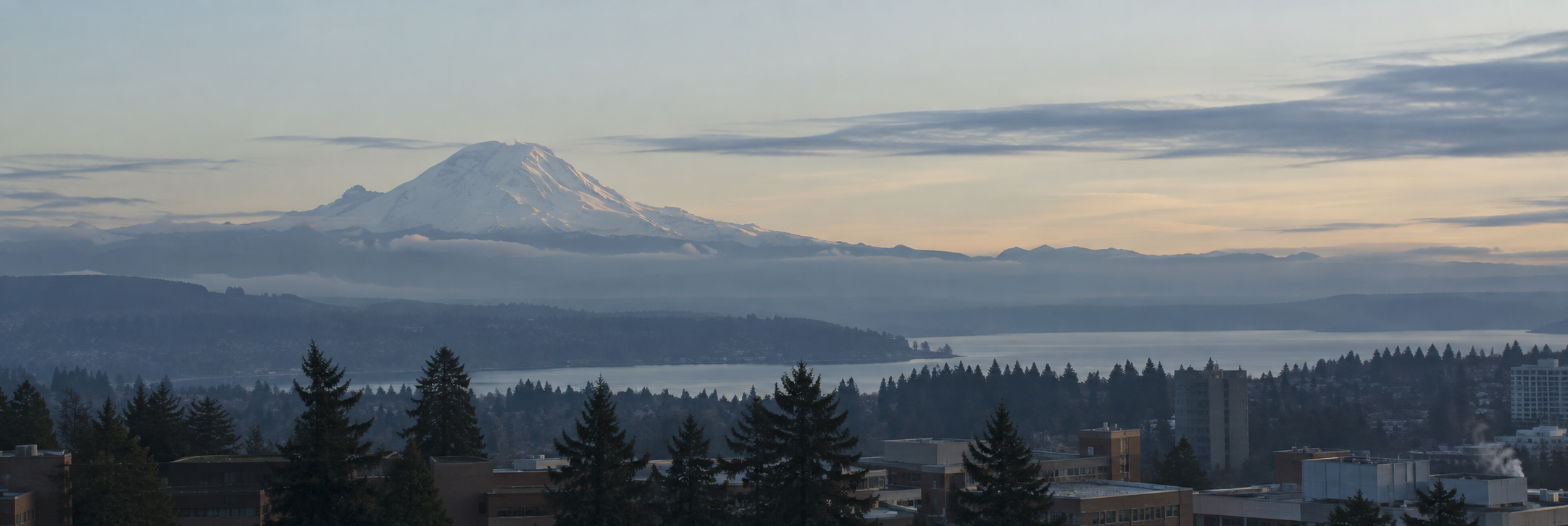 Mount Rainier above the Seattle area in soft morning light